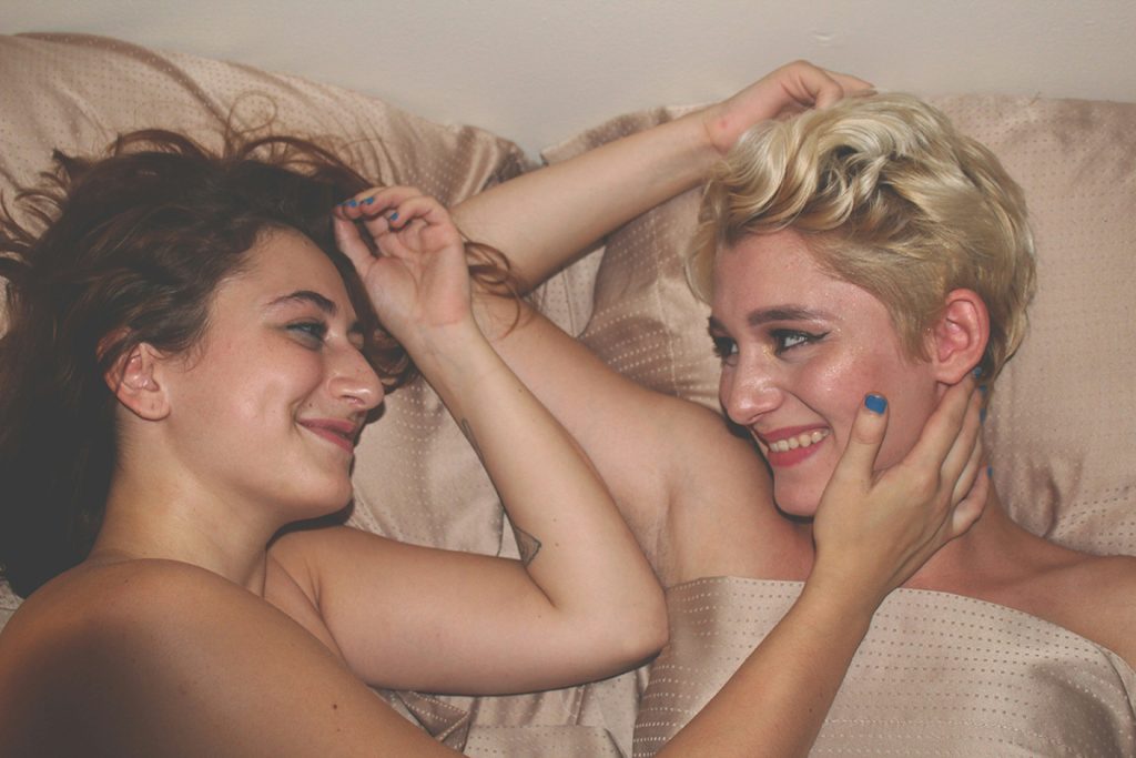 a lesbian couple in bed together
